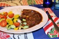 Creole stew with salad and rice